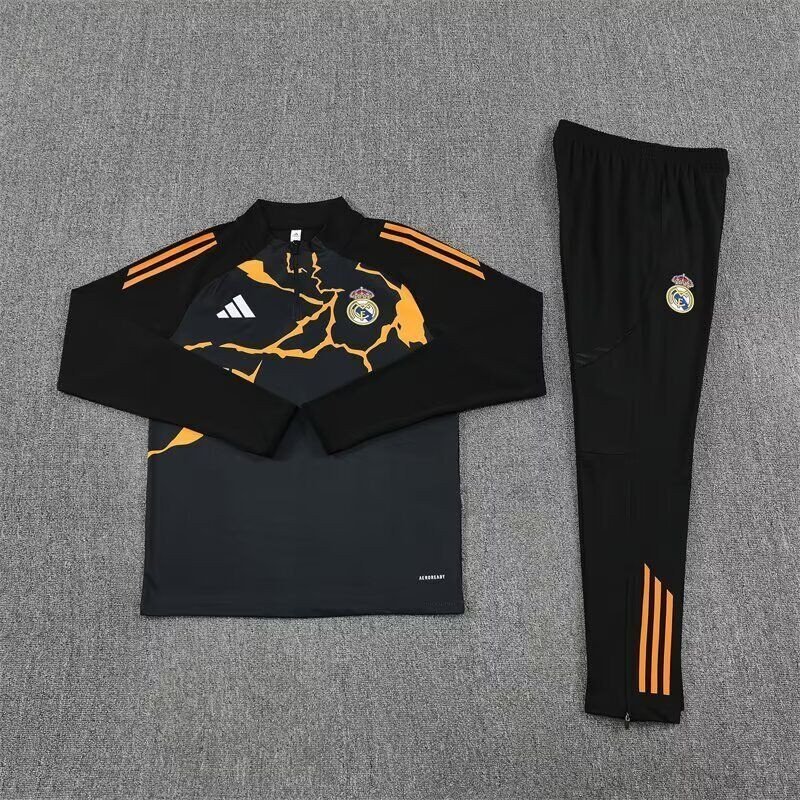 Chandal Niño Entrenamiento Real Madrid Entrenamiento Negro Naranja 25-26 Chandal Niño Entrenamiento Real Madrid Entrenamiento Negro Naranja 25-26